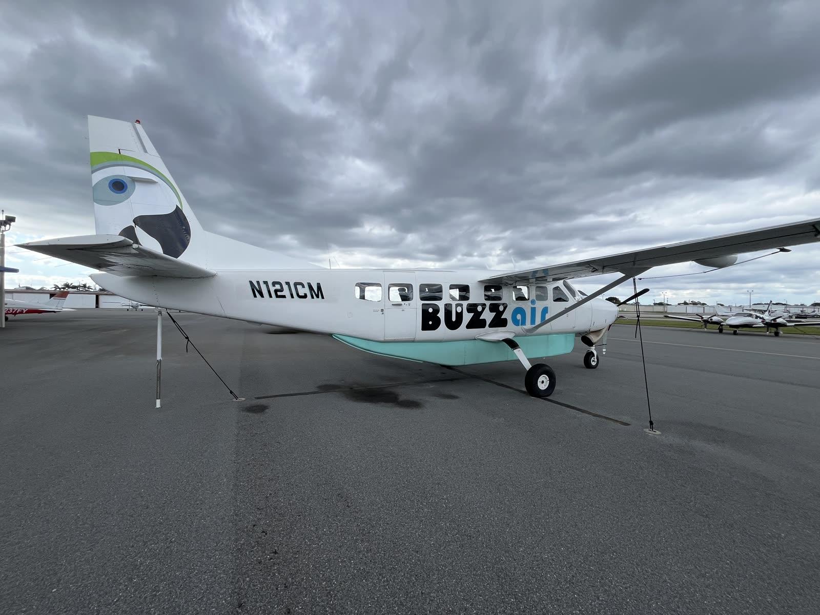 Parrot tail art on Buzz Air's Grand Caravan