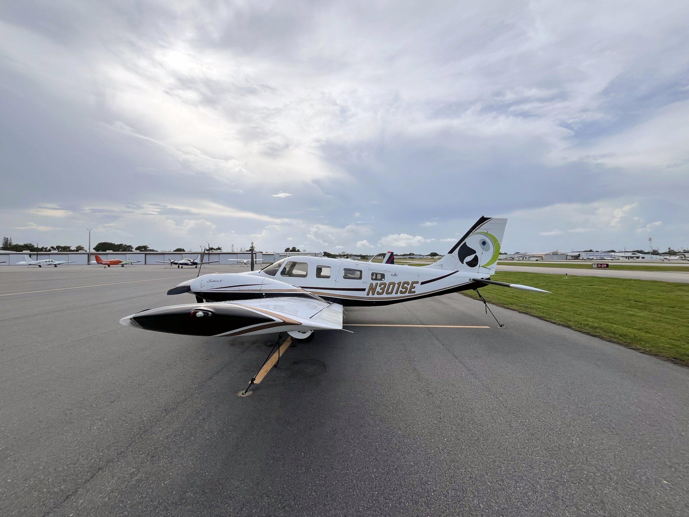 Buzz Air's Piper Seneca N301SE on the ramp