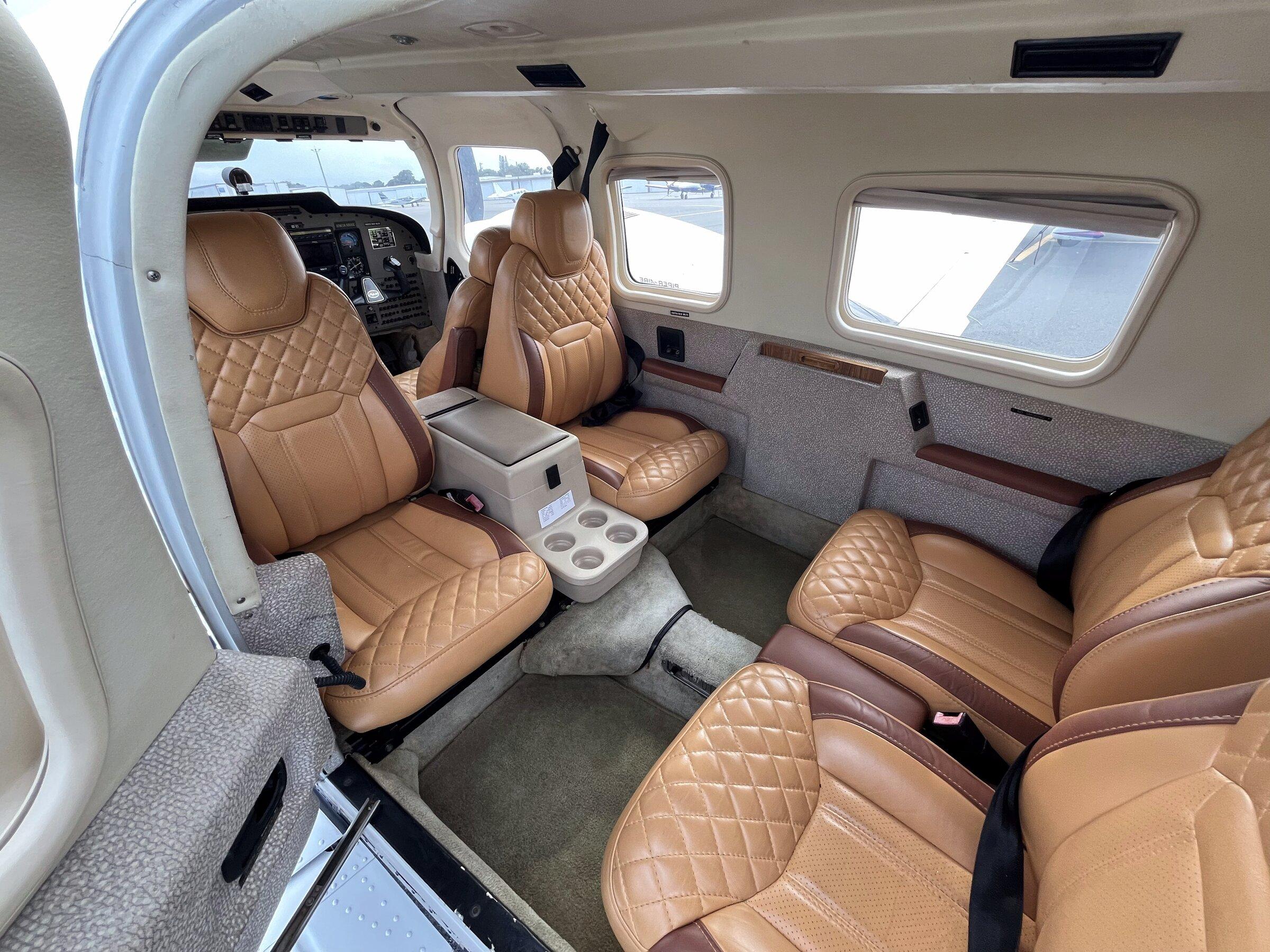 Tan diamond-stitched leather cabin of the Seneca